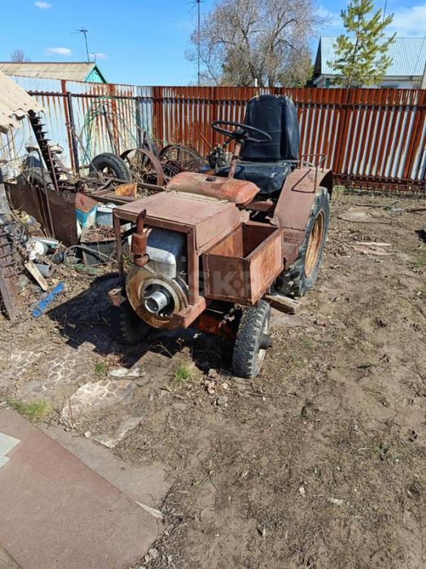 продам мини трактор к нему есть плуг конная косилка и грабли а также много зап частей и два двигател - Орск